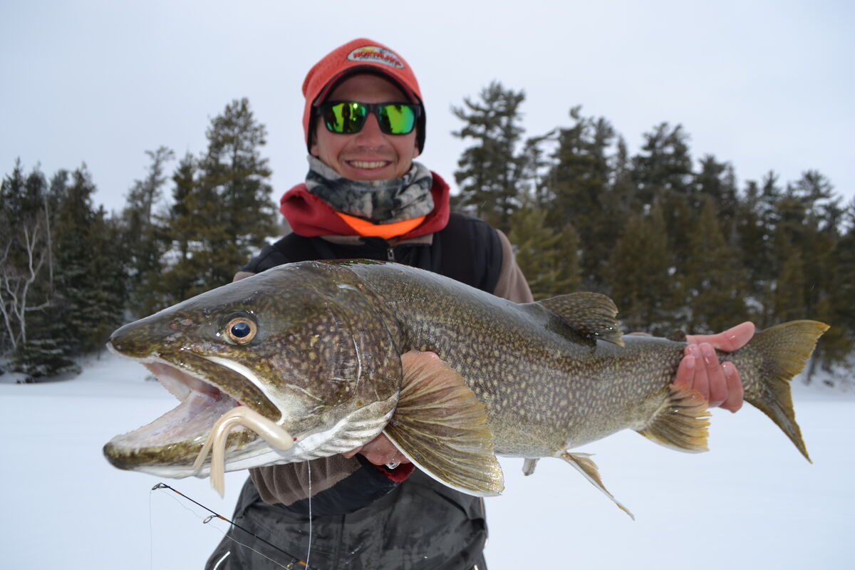 Jeff Gustafson with a Sunset Country lake trout caught through the ice.