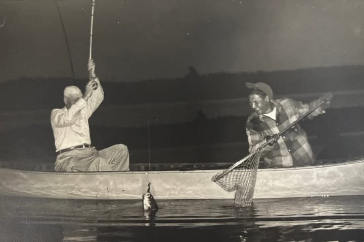 Catching fish out of a canoe!
