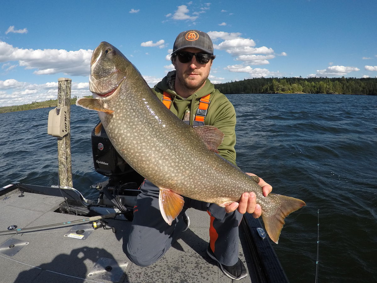 JIGGING UP FALL LAKE TROUT Sunset Country Ontario Canada